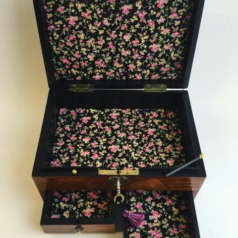 Nicely restored jewellery box with new floral lining 