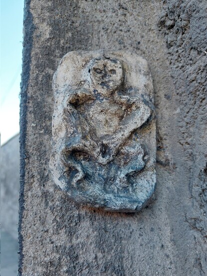 A fake Sheela na Gig on the wall of Grangegorman, Dublin, placed there by a guerrilla art project 