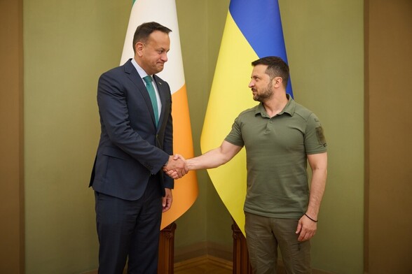 President Zelenskyy of Ukraine  met with 
Taoiseach of Ireland Leo Varadkar, 

Shaking hands with Irish and Ukraine  flags in the background