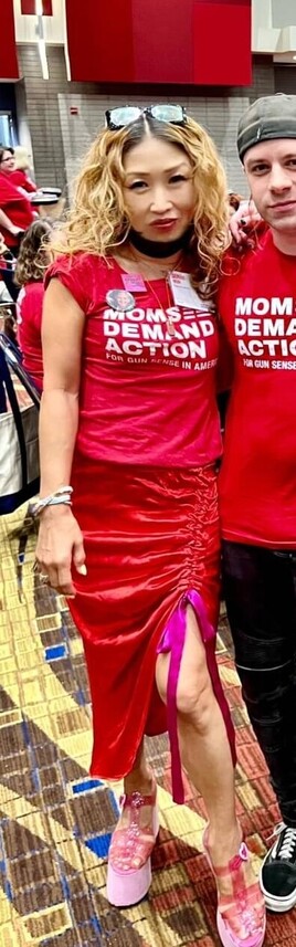 Asian lady wearing Moms Demand Action Tee.