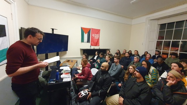 A full room of people in Áras na nGael for the public meeting on Palestine