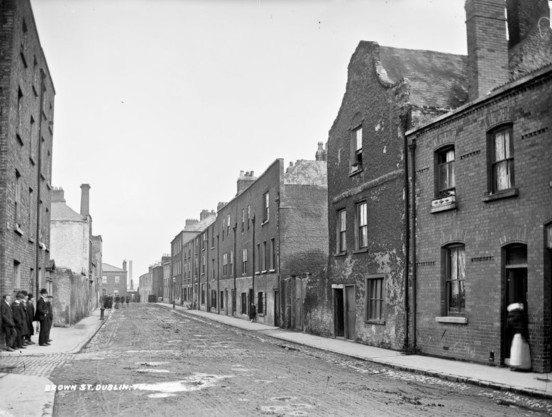 Slums, Dublin City, Co. Dublin. Lawrence Photograph Collection. National Library of Ireland. No known copyright restrictions.

This is Brown Street in the Liberties.