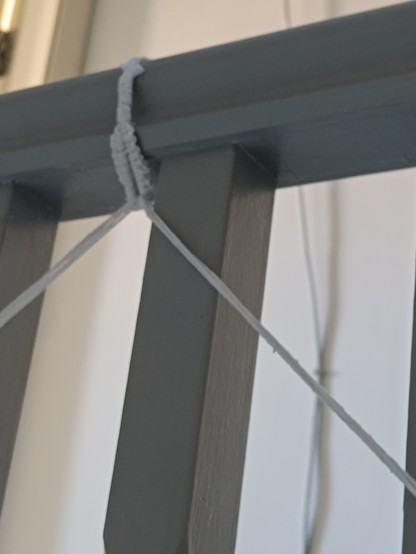 Macrame loop around banister