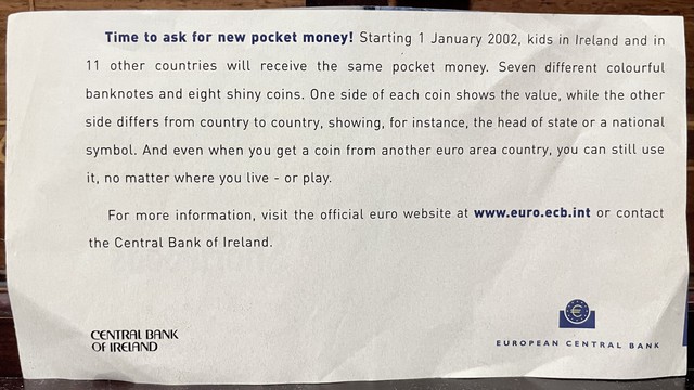 An informational ad from the Central Bank of Ireland discussing the introduction of the euro currency on 1st January 2002. It explains the concept of pocket money for kids, featuring seven colorful banknotes and eight coins, with details about the design