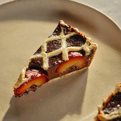 A slice of plum, chocolate and orange tart. Described more fully in the linked article.