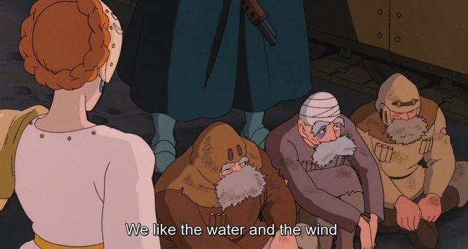 Image from the Japanese animated film Nausicaä of the Valley of the Wind, 1984. On the left, facing into the frame, stands a woman with orange hair tied up. Sitting in front on her are three men with bushy grey beards and scruffy clothes. One of them says, "We like the water and the wind".