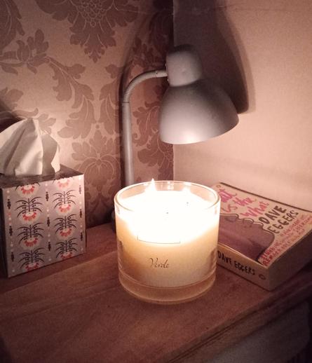 Candle burning in corner of room