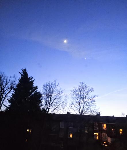 Early evening sky with moon and star.