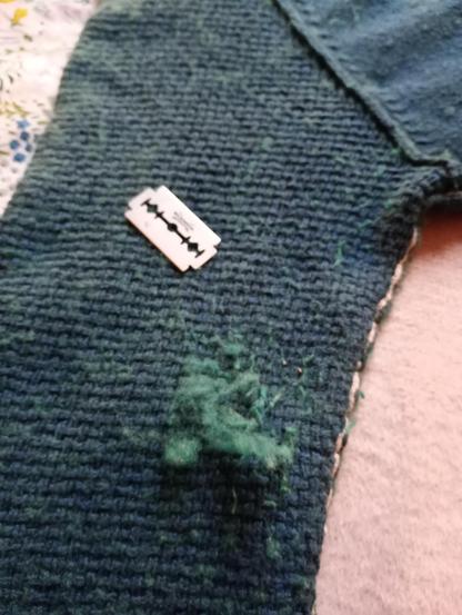 Gillette razor stripping the bobbles from a woolly jumper.