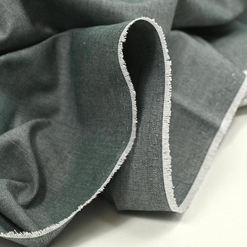 Oxford fabric in "steel" a slightly greenish gray, showing the edge of fabric and white weft