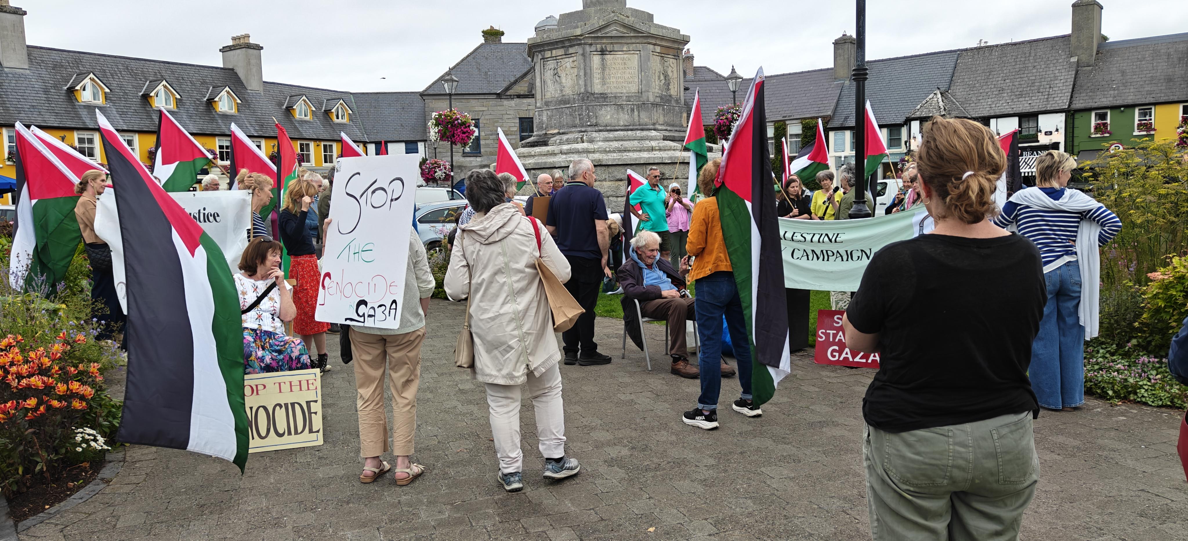 Vigil in Westport Co. Mayo Ireland, about 40-50 people on the Octagon traffic island with Palestinian flags and placards