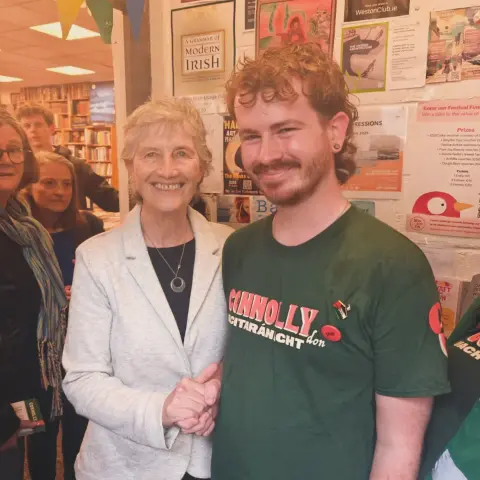 Conall shaking hands with Catherine Connolly