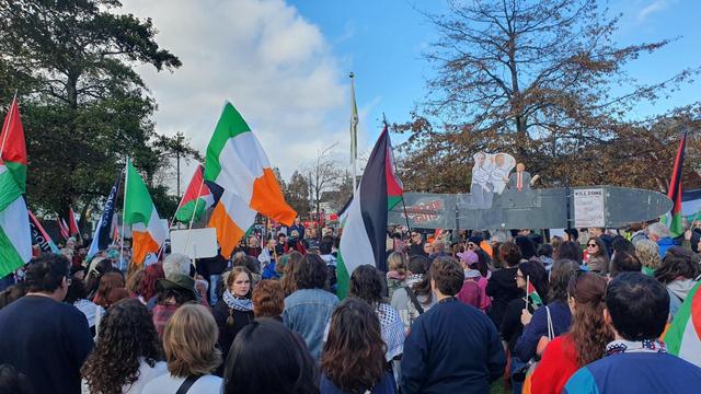 A large crowd of people in Galway City gathering for speakers at a rally for Palestine.