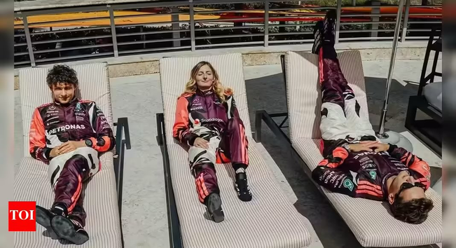 3 people laying on some sunbeds
From Left to Right
* Kimi Antonelli who finished 3rd in the Las Vegas Grand Prix after the McLaren cars were disqualified for skid wear.
* Doriane Pin who won the drivers championship in F1 Academy.
* George Russel (who is upside down on the sunbed) who finished 2nd in the Las Vegas Grand Prix after the McLaren cars were disqualified for skid wear.