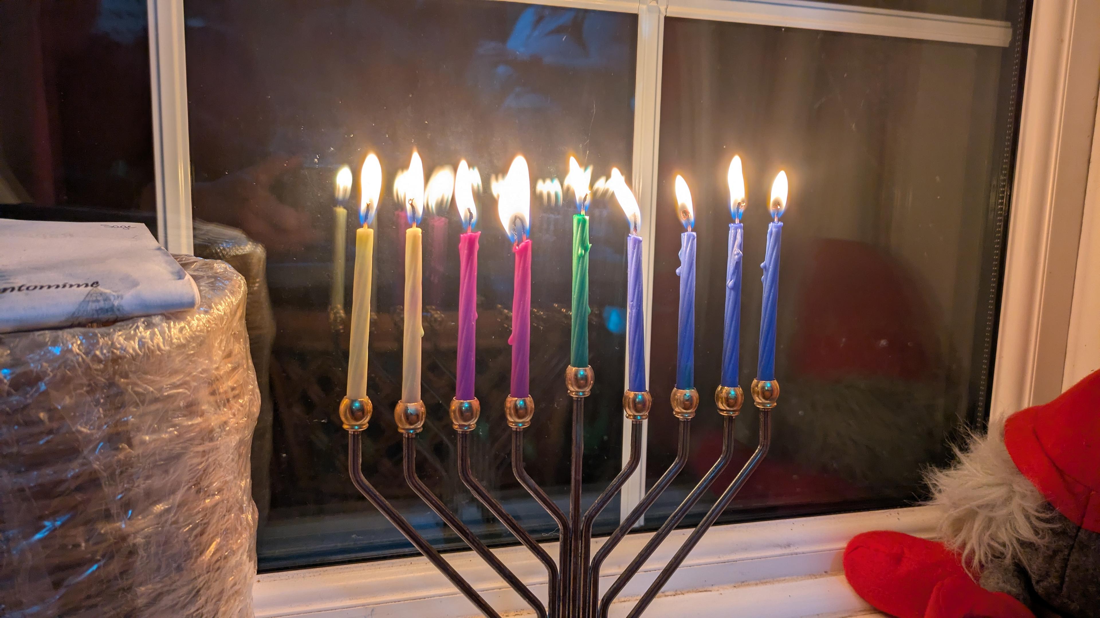 A chanukiah with all the candles lit for the eighth night.