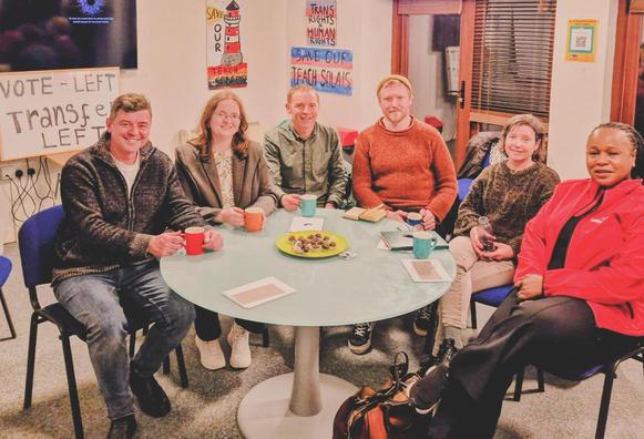 6 candidates from the Galway West by-election sitting down at a table together. From left to right, Mark Lohan (SF), Míde Níc Fhionnlaoich (SocDems), Niall Murphy (Greens), Denman Rooke (PBP), Sheila Garrity (Ind), Helen Ogbu (Lab).