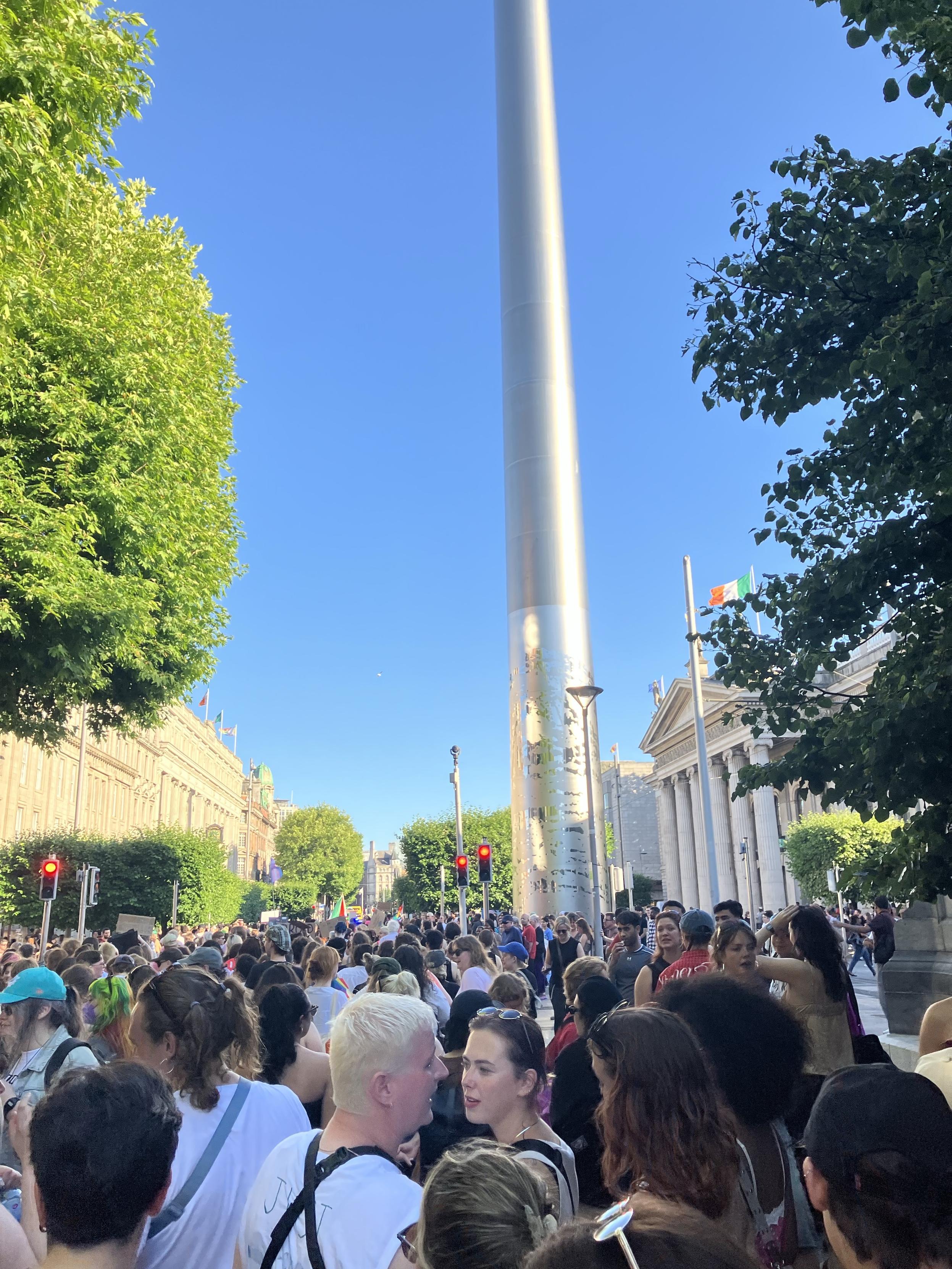 A similar view of the huge Dublin Dyke March crowd, this time looking forward towards O'Connell Bridge, with the GPO, Clery's building, and Spire landmarks also pictured.