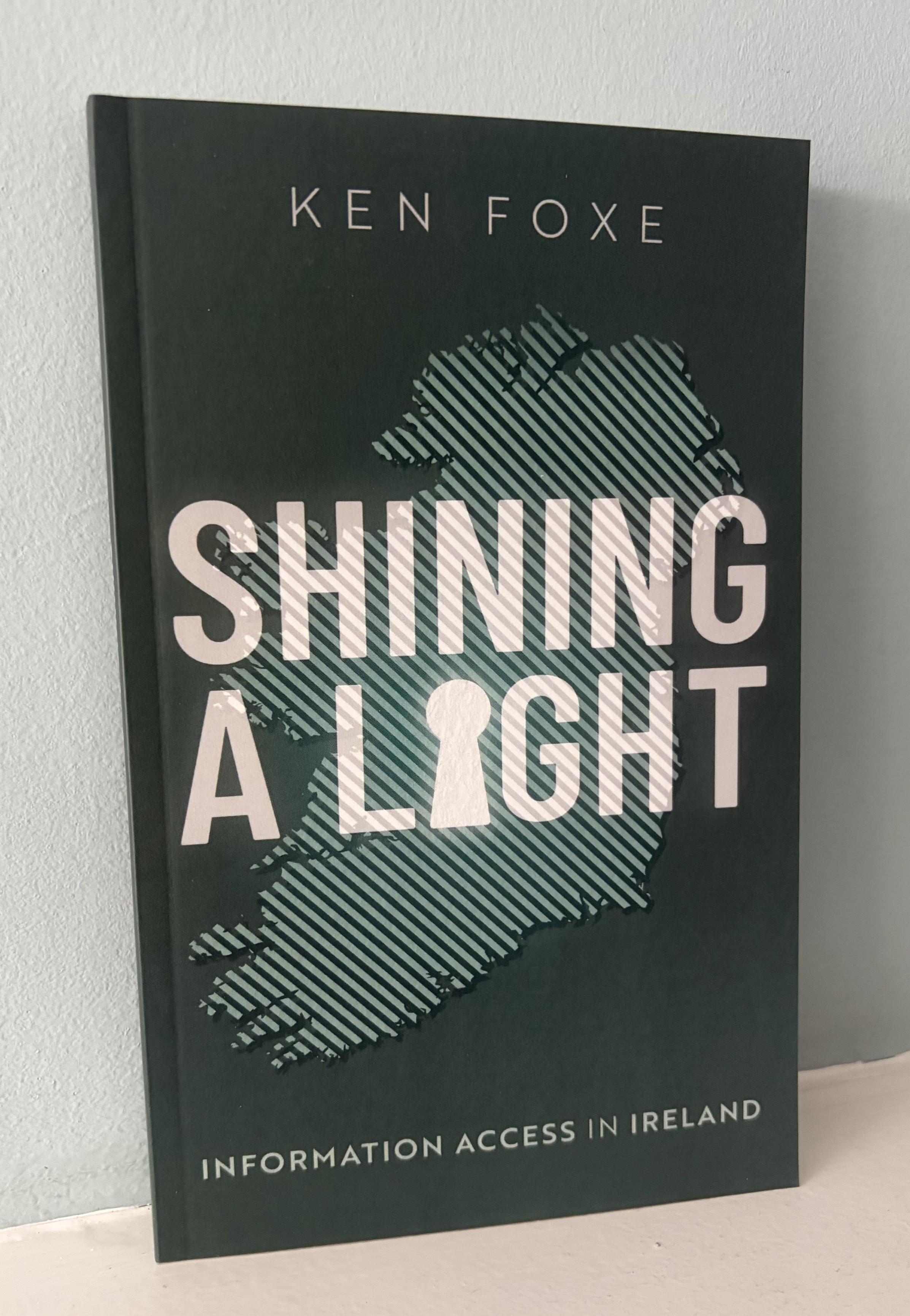 A copy of the information access book Shining a Light by Ken Foxe.