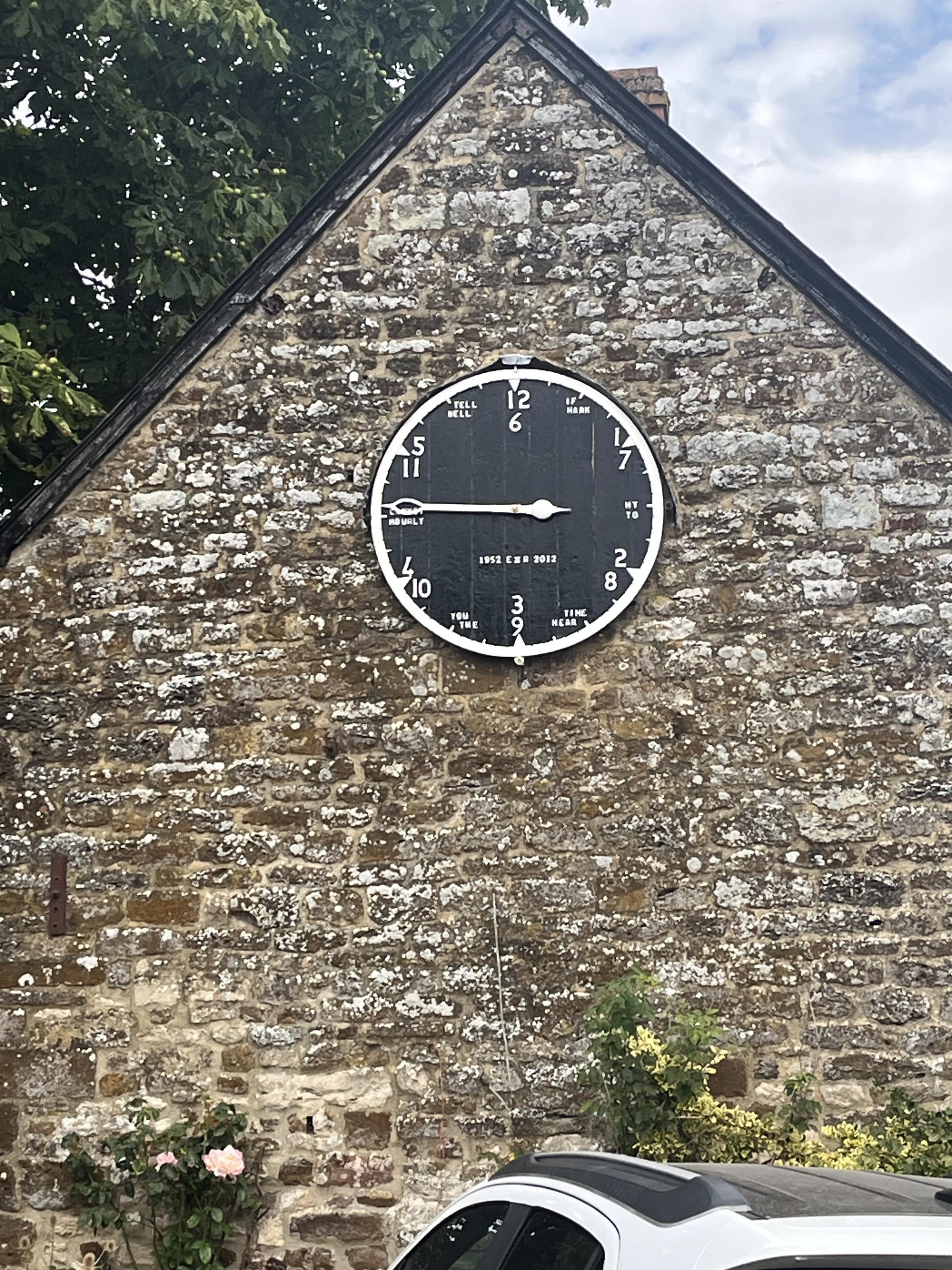 An unusual clock face on the end of a building in Culworth