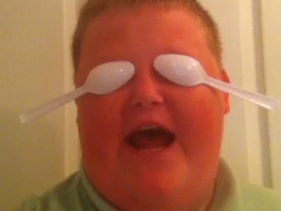 A still from Brenda Bower's infamous Vine about blocking out the haters while 2 plastic spoons cover their eyes. 