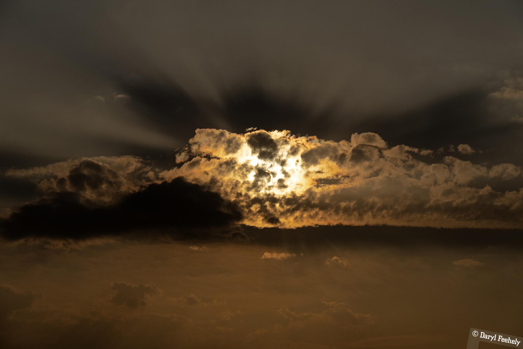 The eclipse obscured by a cloud.