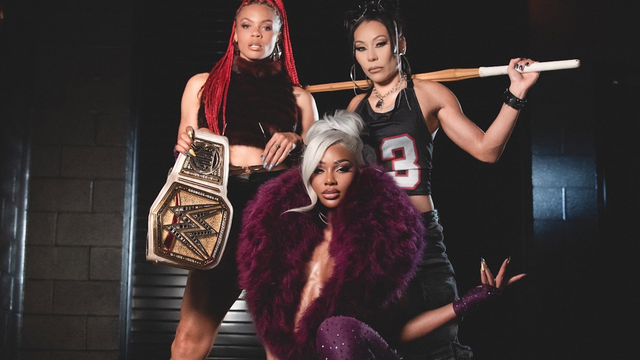 Top-left: B-Fab
Top-right: Michin
Bottom: Jade Cargill

B-Fab has red dreads. She is wearing a fluffy armless top.
She is holding a pair of sunglasses in her left hand.
And she is holding Jade's WWE Women's Championship title.

Michin has black hair with big hooped earrings.
She is wearing a cropped, armless jersey of a nondescript sports team.
She has a kendo stick mounted up behind her shoulders.

Jade had grey/white hair that is tied up with her fringe covering the right side of …