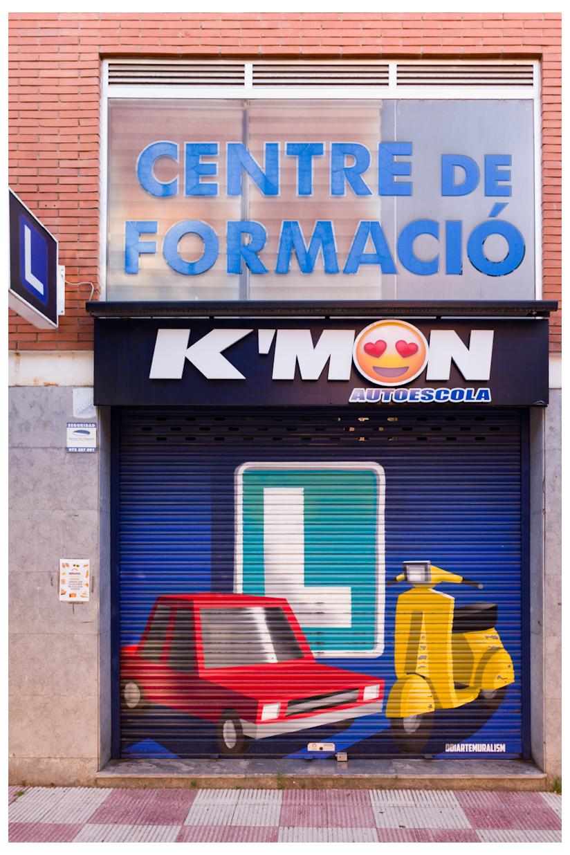 A mural on shutters of driving school depicting vehicles.