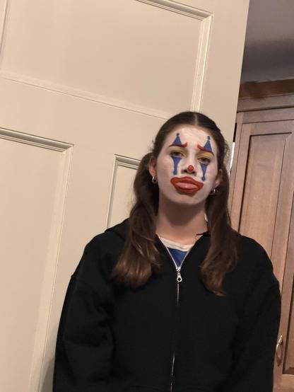 A girl in creepy clown makeup