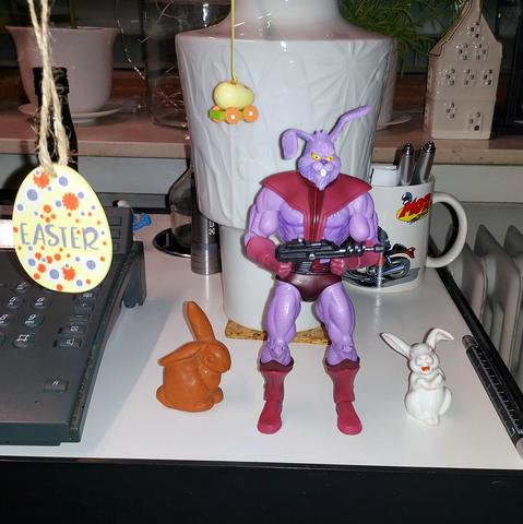 Three bunnies guarding the Easter branches
