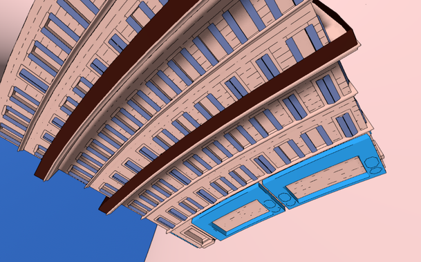 Building with two balconies and shops