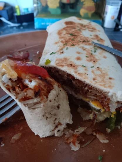 Bacon, egg, hash browns, green Chile, cheddar burrito!
