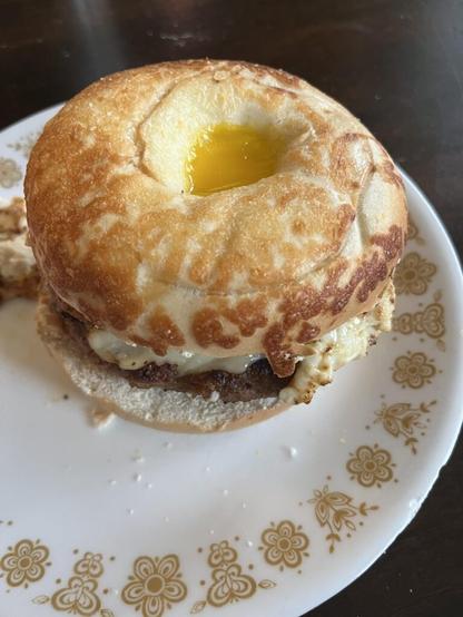 My favorite breakfast sandwich ever: sausage, hash brown, sunny side up egg, and cheese on an Asiago bagel