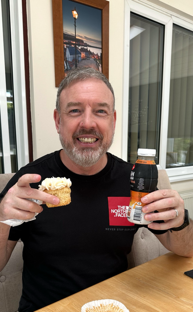 Happy man wif cake and protein shake