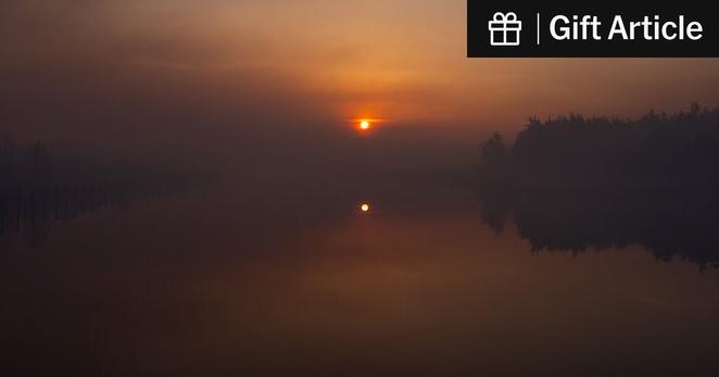 Sunrise, shrouded in wildfire smoke, in Forked River, N.J., on Thursday. The National Climate Assessment examines how global warming affects aspects of American life from public health to the economy.