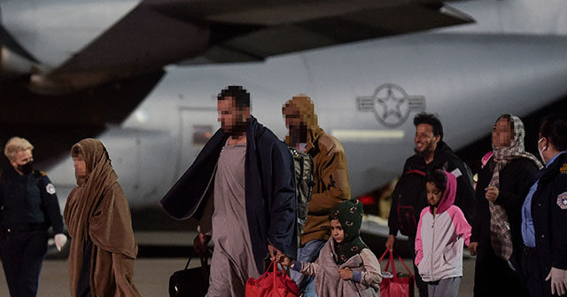 Afghan refugees, fleeing the Afghan capital Kabul, exit an US air force plane upon their arrival at Pristina International airport near Pristina on August 29, 2021. - Kosovo has offered to take in temporarily thousands of Afghan refugees evacuated by US forces from Kabul until their asylum claims are processed. (Photo by Armend NIMANI / AFP) (Photo by ARMEND NIMANI/AFP via Getty Images)