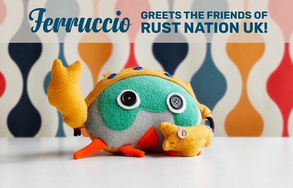 Ferruccio (RustLab crab mascot, stuffed toy) greets the friends of Rust Nation UK