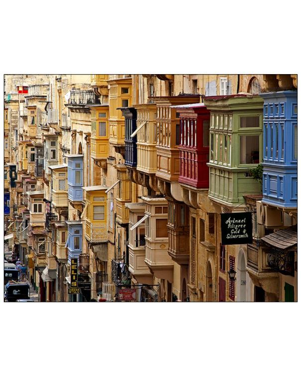 Coloured boxed balconies on a street.