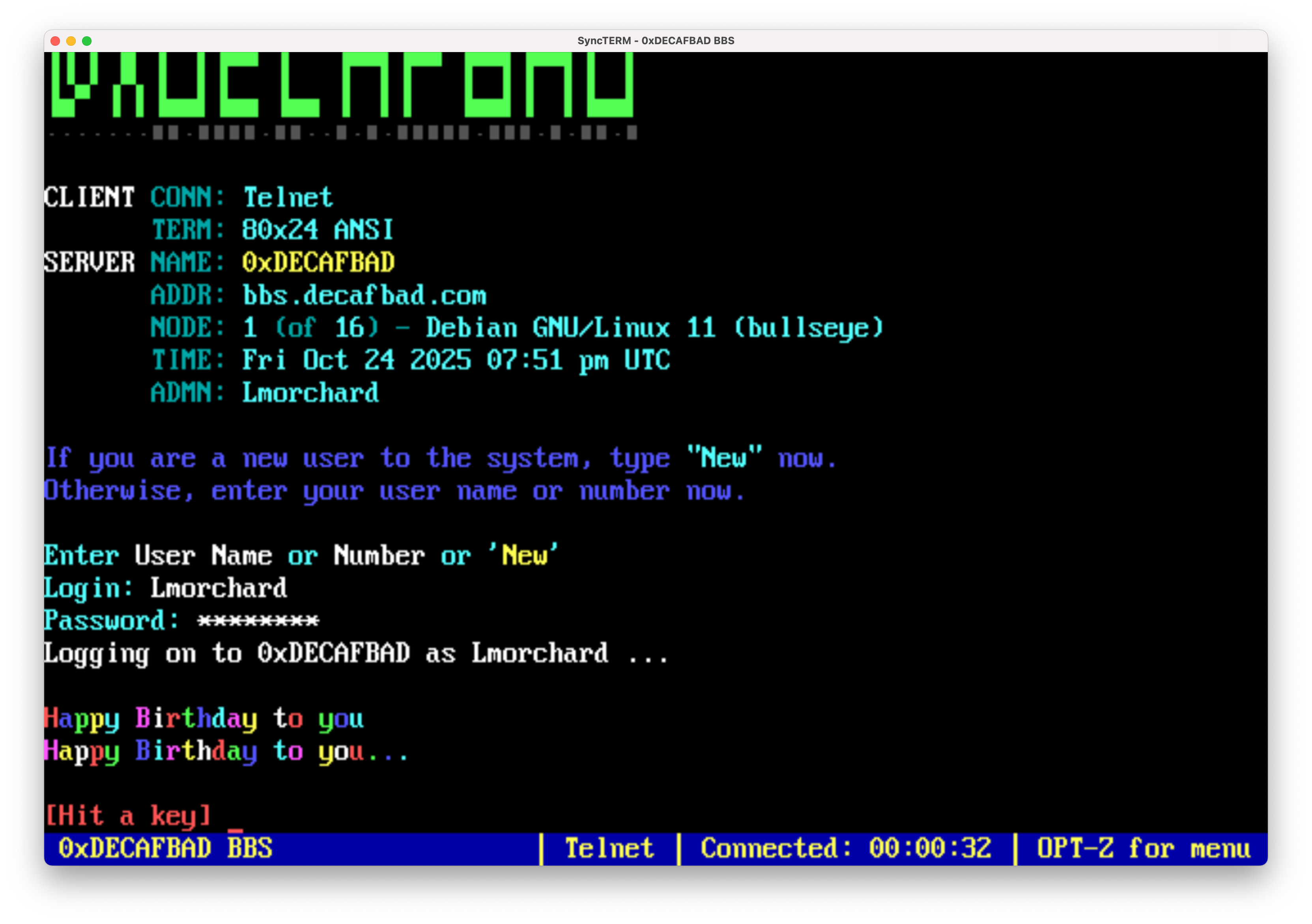 Screenshot of 0xDECAFBAD BBS login displaying colorful Happy Birthday messages in rainbow text on a black terminal screen