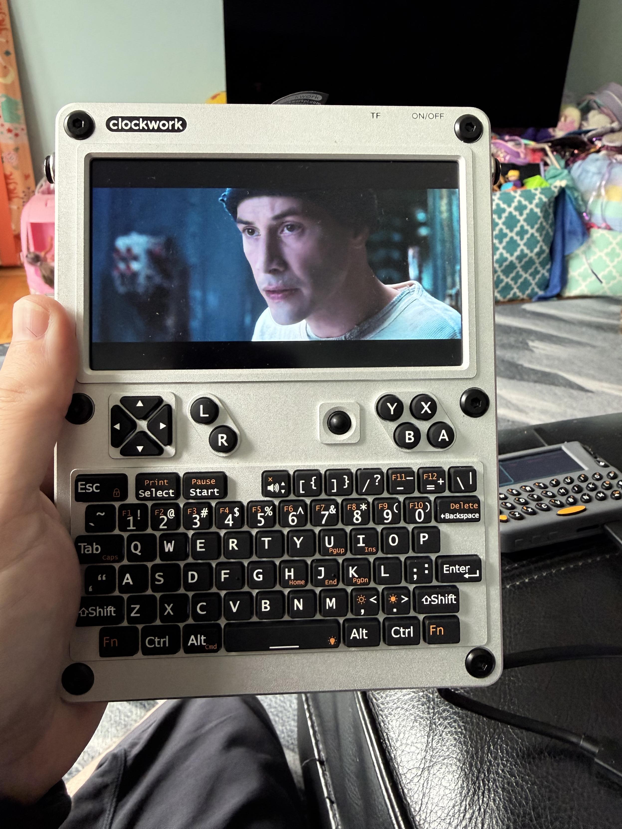 ClockworkPi Uconsole with a scene from The Matrix displayed