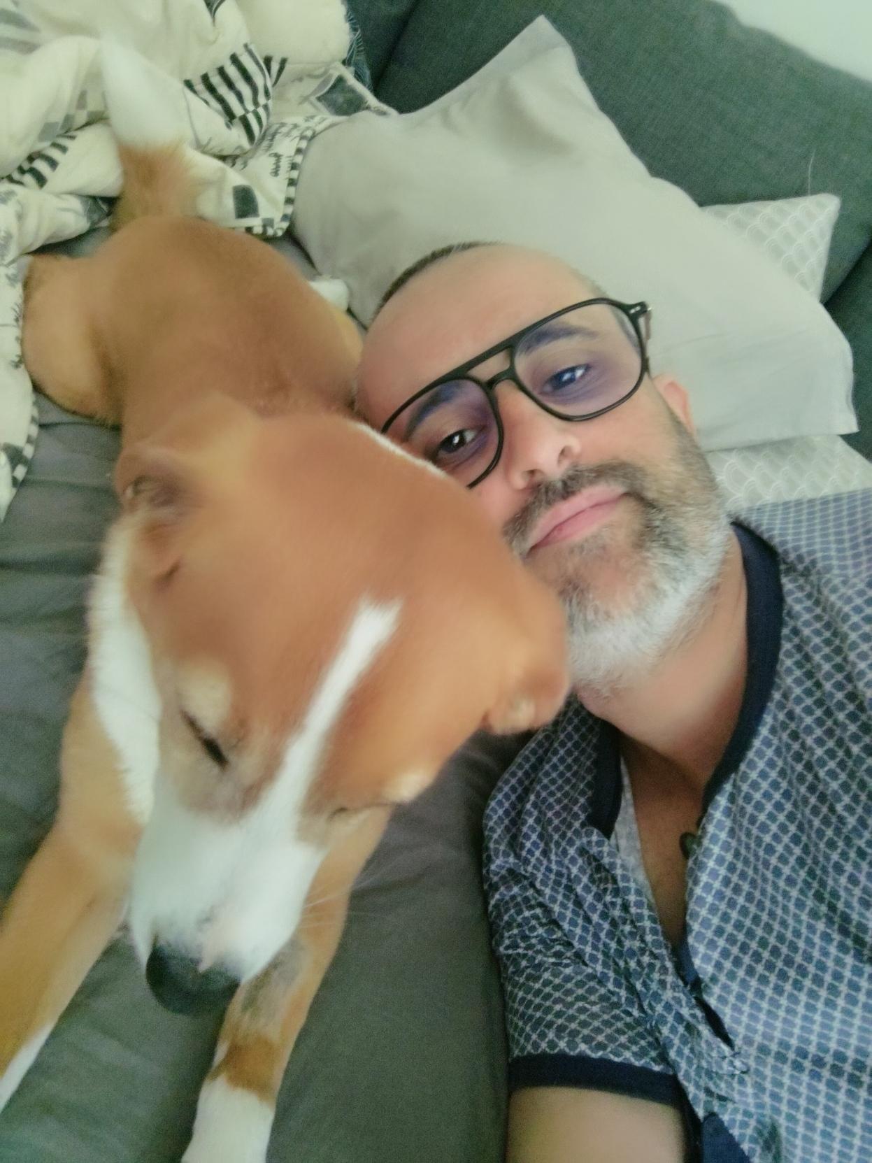 Me and my dog laying on the sofa after taking a nap