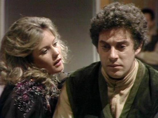 Claude Sonnet 4.0 describes the image as: "I can see this appears to be from a science fiction television series, showing two people in what looks like a dramatic scene. One person has curly blonde hair and is wearing what appears to be a sparkly or sequined dark outfit, while the other has dark curly hair and is wearing what looks like a green or olive-colored garment. The setting appears to be indoors with muted lighting, suggesting this might be taking place on a spacecraft or futuristic int…