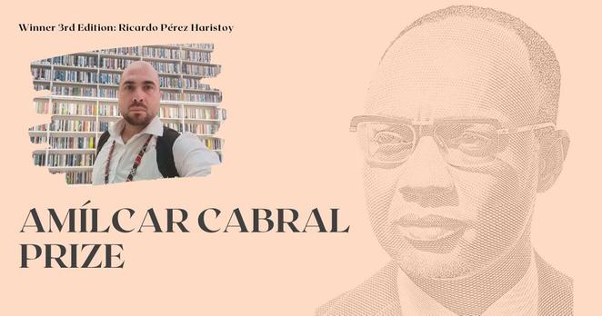 Illustrative image of the news of the winner of the third edition of the Amílcar Cabral Prize. It includes a photo of the winner, Ricardo Pérez Haristoy, a white, bald man with a short beard.  It also includes a drawing of Amílcar Cabral's face, a black man with glasses and very short hair. On a very light orange background are the texts “Winner third edition: Ricardo Pérez Haristoy” and "Amílcar Cabral Prize".