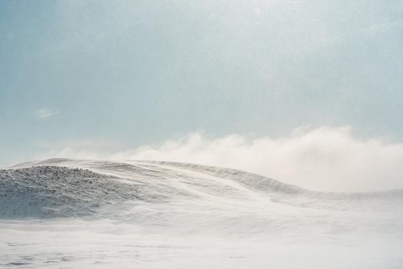 Photo of windy fjells in the Käsivarsi Wilderness Area, Finland, taken during a solo ski tour after a blizzard.
