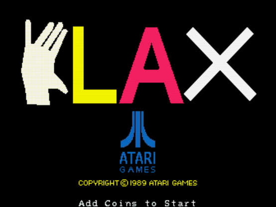 Another capture from Klax's attract sequence. It shows the Atari Games logo, and the word "Klax" where the "K" is a hand (that rotates and gets replaced by an actual "K" periodically).