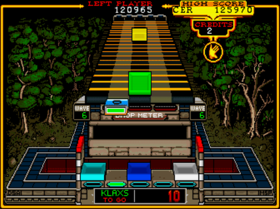 In this level, you have do do a certain number of "Klaxs" (rows, columns, diagonals of the same color) to complete the level. The "drop meter" says you can't fail to catch more than 3 blocks.

Of course, as the level goes on, it becomes harder to catch them all, and that's how you lose.