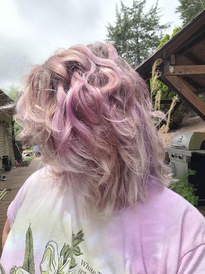 A side profile highlights different shades of blonde, pink, and lavender in my hair.