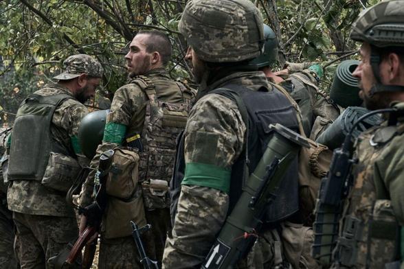 The infantry of the 59th Motorized Infantry Mechanized Brigade return from their infantry positions, where they stayed for two weeks, and are resting in the bushes near the front line on Sept. 19, 2024 near Pokrovsk, Ukraine