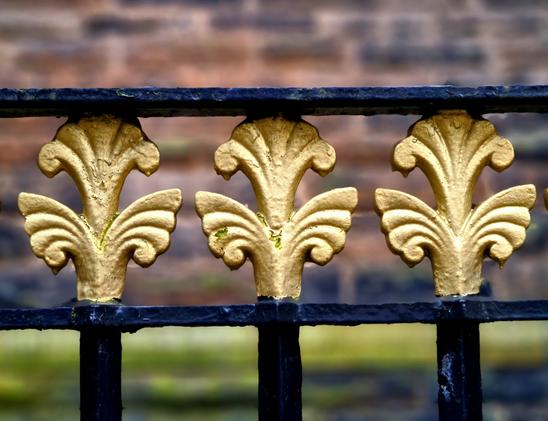 Victorian railings painted black and gold.