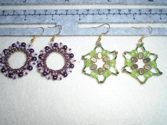 Two more pairs of bead earrings.  The pair on the left is wreath style in burgundy and clear crystal, while the pair on the right is star-shaped in peridot green and gold.
