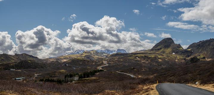 A panoramic image of the Hengill area just south of Thingvellir in Iceland. Blu sky with scattered clouds.